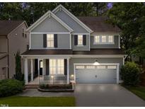 Charming two-story home with a two-car garage and inviting front porch at 904 Pirouette Ct, Raleigh, NC 27606