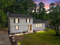 Charming two-story home featuring manicured lawn, updated windows and neutral paint colors at 1143 Sturdivant Dr, Cary, NC 27511