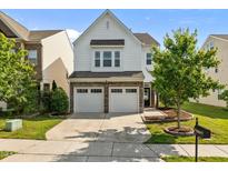 Charming two-story home features a two-car garage and well-maintained landscaping at 2036 October Dr, Durham, NC 27703