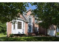 Charming brick home with a well-manicured lawn and mature trees at 227 Shalimar Dr, Durham, NC 27713