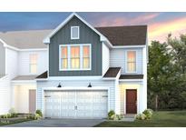 New construction home boasts board and batten siding, a two-car garage, and professionally landscaped front yard at 5000 Reader Way, Durham, NC 27703