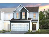 Charming two-story home featuring a two-car garage, landscaped yard and modern architectural elements at 5010 Reader Way, Durham, NC 27703