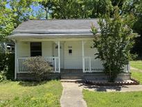 Charming home featuring a cozy front porch and landscaped front yard at 709 Gerard St, Durham, NC 27701