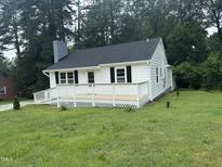 Charming home featuring a newly constructed deck and freshly painted exterior at 902 Roanoke Ave, Henderson, NC 27536