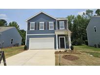 Charming two-story home with a two-car garage and classic curb appeal at 134 N Keatts Winner Ct, Wilson's Mills, NC 27520