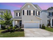 Charming two-story home with a two-car garage and manicured landscaping at 2128 Jollay St, Durham, NC 27703