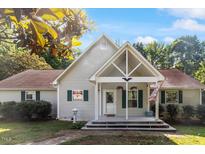 Charming single-story home featuring a covered front porch and well-maintained landscaping at 3298 Oakridge Dr # A, Graham, NC 27253