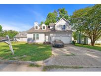 Charming two-story home featuring a two-car garage and a well-maintained front yard at 3712 Old Coach Rd, Raleigh, NC 27616