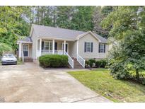 Charming home featuring a well-manicured front yard and a welcoming porch at 5817 Seward Dr, Knightdale, NC 27545