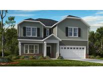 Charming two-story home with a two-car garage, a covered entry, and a well-maintained lawn at 668 Morning Glade St, Wake Forest, NC 27587