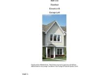 Charming two-story home with white trim, inviting entry, and well-maintained landscaping at 3191 Mission Olive Pl # 350, New Hill, NC 27562