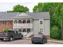 Condo exterior featuring covered second story porch and two car parking at 405 Gooseneck Dr # B6, Cary, NC 27513