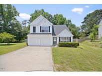 Charming two-story home featuring a two-car garage, well-manicured lawn, and inviting curb appeal at 4805 Castle Crest Ct, Raleigh, NC 27616