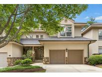 Charming two-story home with stone accents, attached two car garage, and manicured landscaping at 95113 Vance Knls, Chapel Hill, NC 27517