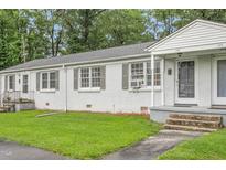 Charming brick duplex with well-maintained lawn and inviting entrance at 1400 Roslyn Dr # 17B, Burlington, NC 27215