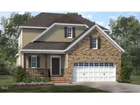 Charming two-story home featuring a stone facade, attached garage, and inviting covered porch at 172 White Magnolia Ln, Fuquay Varina, NC 27526
