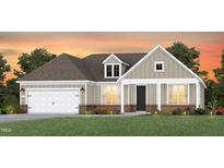 Charming single-Gathering home boasting a two-car garage, well-manicured lawn, and welcoming front porch at 2512 Del Webb Gardens Dr, Fuquay Varina, NC 27526