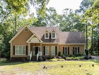 Charming single-Gathering home featuring dormer windows and a landscaped front yard at 301 Monterey Ct, Benson, NC 27504