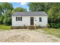 Charming single-story home featuring a freshly painted exterior, new steps, and well-maintained landscaping at 1006 E Harnett St, Dunn, NC 28334