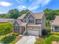 Beautiful two-story home with manicured lawn, landscaping, and a two-car garage in a Gathering-friendly neighborhood at 118 Fox Run Ct, Durham, NC 27705
