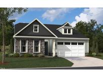 Charming home featuring stone accents, gray shingles, light blue siding, a 2-car garage and well-manicured lawn at 2004 Kapalua Way # 189, Durham, NC 27703