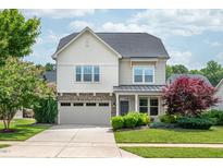 Charming two-story home with a stone-accented garage and beautiful landscaping at 337 Botan Way, Hillsborough, NC 27278