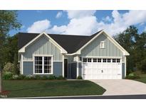 Charming two-story home with a two-car garage, well-manicured lawn, and traditional architectural details at 2013 Kapalua Way # 197, Durham, NC 27703