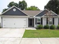 Charming single-story home with a two-car garage and well-maintained front lawn at 2039 Alderman Way, Creedmoor, NC 27522