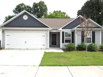 Charming single-story home with a two-car garage, well-kept lawn, and inviting curb appeal at 2039 Alderman Way, Creedmoor, NC 27522