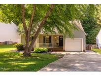Charming home featuring a well-manicured lawn, covered porch and an attached one car garage at 358 Tillamook Dr, Wake Forest, NC 27587