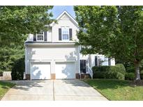 Charming two-story home featuring a two-car garage and manicured landscaping at 803 High Ct, Hillsborough, NC 27278