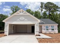 Charming home featuring an attached two-car garage and a light-filled design at 303 Rothbury Ct, Sanford, NC 27330