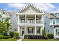 Charming two-story home boasting double porches and manicured landscaping at 316 Levi Ln, Wake Forest, NC 27587