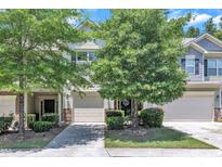 Charming townhome exterior with well-maintained landscaping and inviting facade in a suburban community at 342 Westgrove Ct, Durham, NC 27703