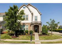 Charming home featuring manicured landscaping, stone accents, and a welcoming front porch at 1041 Pemberly Ave, Morrisville, NC 27560