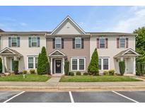 Charming townhome featuring neutral siding, black shutters, manicured landscaping, and clearly marked unit numbers at 1108 Renewal Pl, Raleigh, NC 27603
