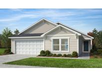Charming single-story home features a two-car garage, neutral siding, and a well-manicured front yard at 125 Fraiser Fir Way, Lillington, NC 27546