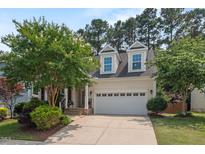 Charming home featuring well-maintained landscaping and a two-car garage at 1612 Old Bramble Ln, Fuquay Varina, NC 27526