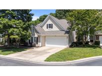 Charming home featuring neutral siding, a two-car garage, and well-maintained landscaping in a suburban neighborhood at 206 Lake Brandt Dr, Cary, NC 27519