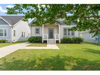 Charming single-Gathering home with a well-manicured lawn and inviting front porch at 225 East End Ave, Durham, NC 27703