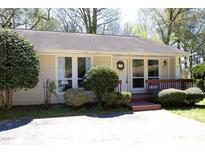 Charming single-story home with a well-manicured yard and inviting front porch at 103 Westview # H, Carrboro, NC 27510