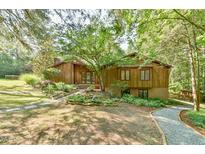 Beautiful exterior of a wood home featuring professional landscaping and stone walkways at 36 Birnamwood Dr, Chapel Hill, NC 27516