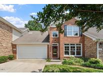 Charming two-story home featuring a combination of brick and stone facade, plus a two-car garage at 4724 Ludwell Branch Ct, Raleigh, NC 27612