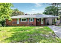 Charming single-story brick home with well-maintained lawn and inviting carport at 603 Nellane Dr, Garner, NC 27529