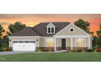 Charming single-story home with a neutral color palette, attached garage, and well-manicured lawn at 87 Arcadius Dr, Clayton, NC 27520