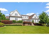 Stunning home featuring a meticulously landscaped front yard and classic architectural details and multi-level garden at 1342 Briar Chapel Pkwy, Chapel Hill, NC 27516