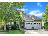 Charming home with a two-car garage and well-maintained landscaping at 1808 Pennypacker Ln, Durham, NC 27703