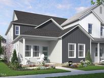 Charming two-story home with a covered front porch and beautifully landscaped front yard at 2922 Alyssa Ct, Raleigh, NC 27604