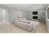 Bright living room with a fireplace, built-in shelves, and neutral decor creates a welcoming space at 3088 Colony Rd # A, Durham, NC 27705