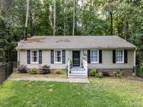 Charming single story home with black shutters and well maintained front yard at 3600 Star Trek Ct, Raleigh, NC 27604